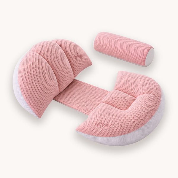 Winged maternity pillow set in blush pink, shown against a plain background